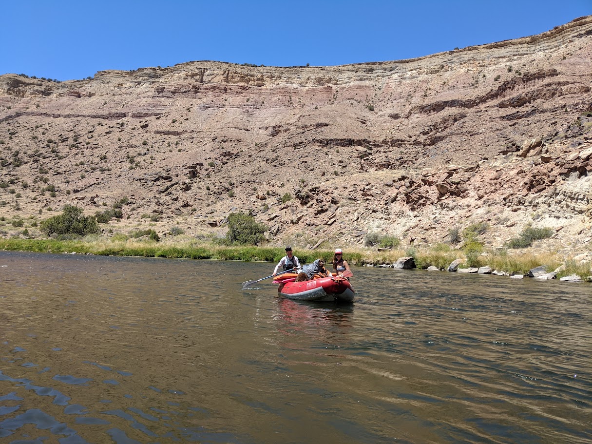 A picture of Wade, Hannah and Pancho on a raft
