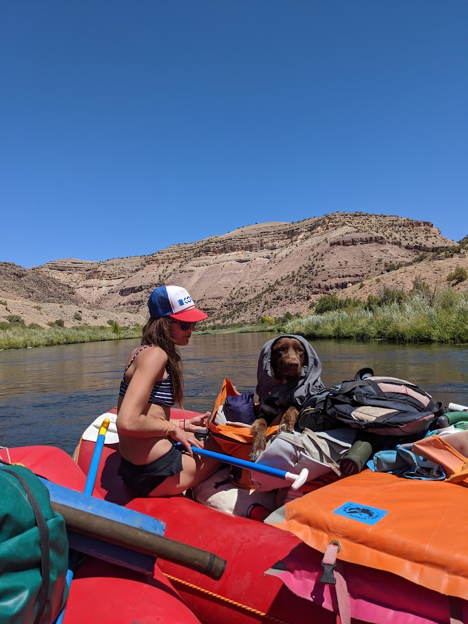 A picture of Hannah and Pancho on a raft