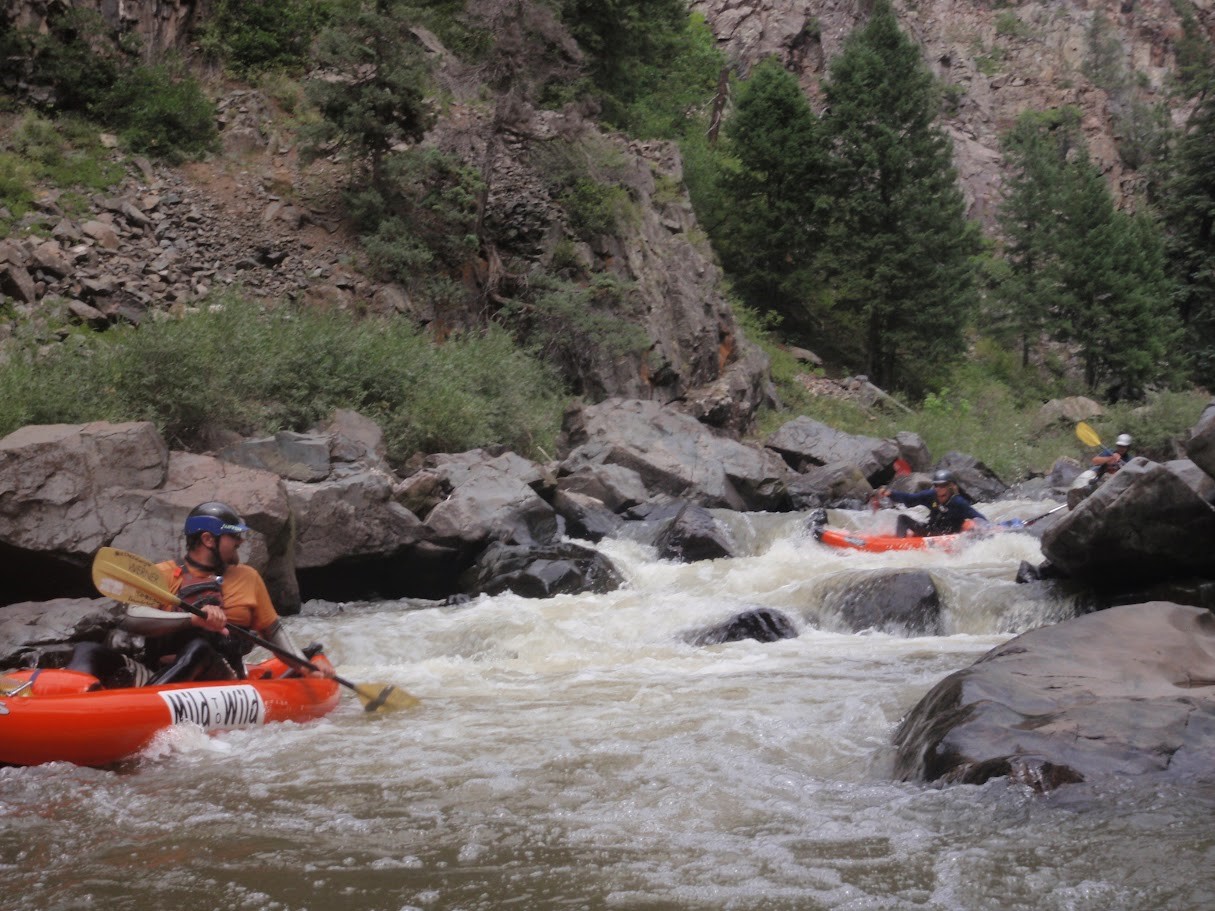A view upstream of duckies in Son of Mud rapid
