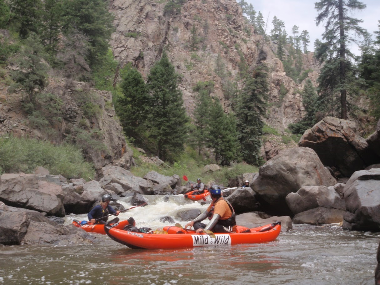 A view upstream of duckies in Son of Mud rapid