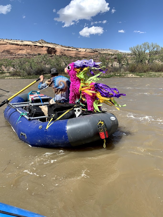 A picture of Elliot and the Pinata on the raft