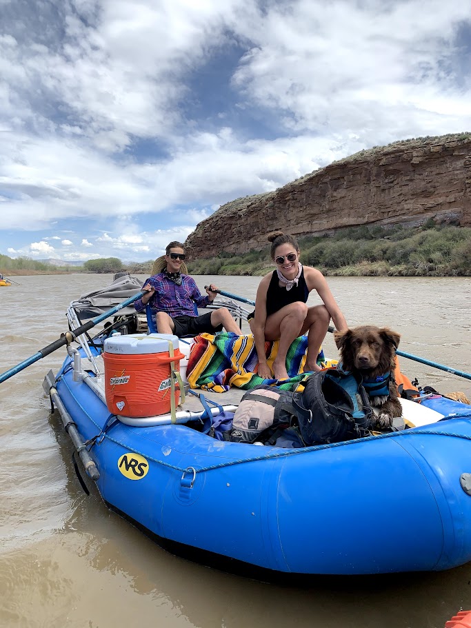 A picture of Wade, Hannah and Pancho on a raft